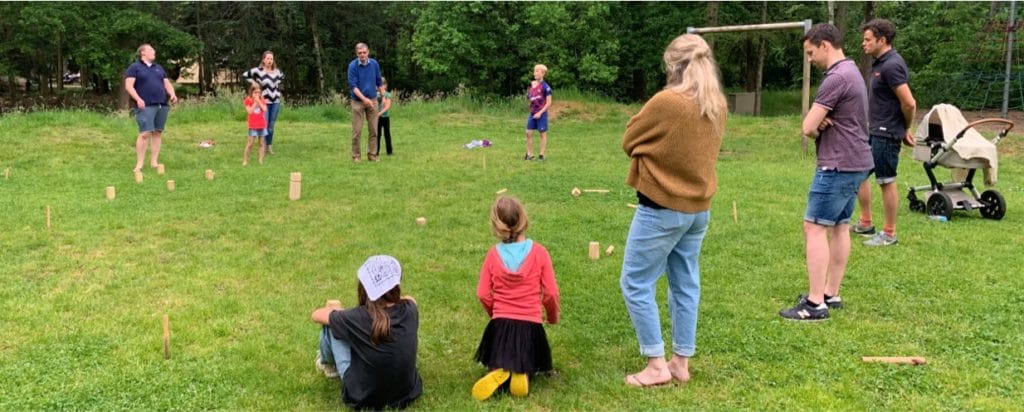 People enjoying the great game of Kubb